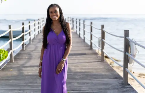 Smiling African woman posing for Breast Augmentation